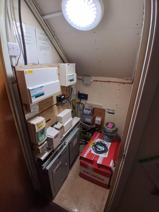 Residential care homes: Intake cupboard during remedial works